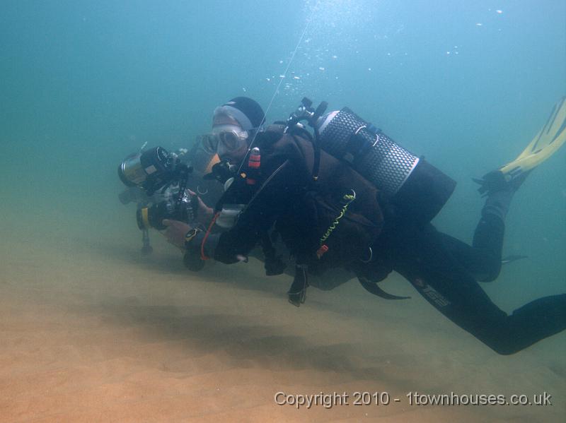 EPL13944.jpg - Homo sapiens - Dave and Rob making the short swim across the sand