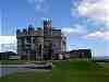 The castle with 2 Tudor relics having a sit down outside