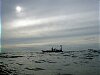 Alone on a gentle sea, Pete and Simon wait for us on Calypso