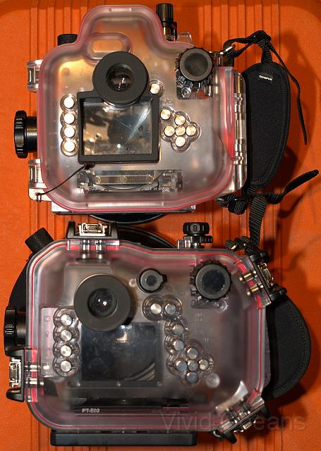 PC142011.jpg - Neither housing is smothered with buttons but the loss of the E-330's extra liveview modes sheds 3 controls. The power bulge for the flash  disguises adds to the height of the otherwise well tailored case.