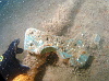 Something fascinating on the aft deck close to the conning tower.